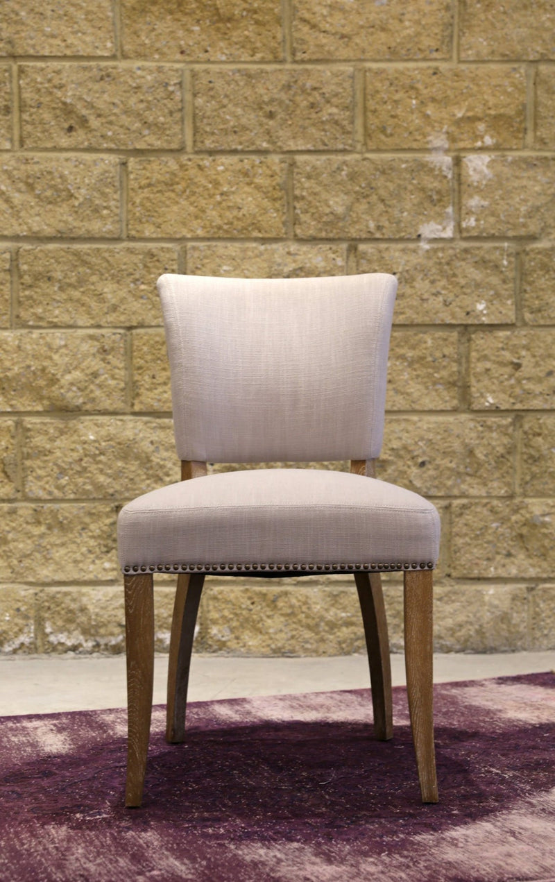 7. "Luther Dining Chair - Oyster: Neutral color that complements any interior decor"