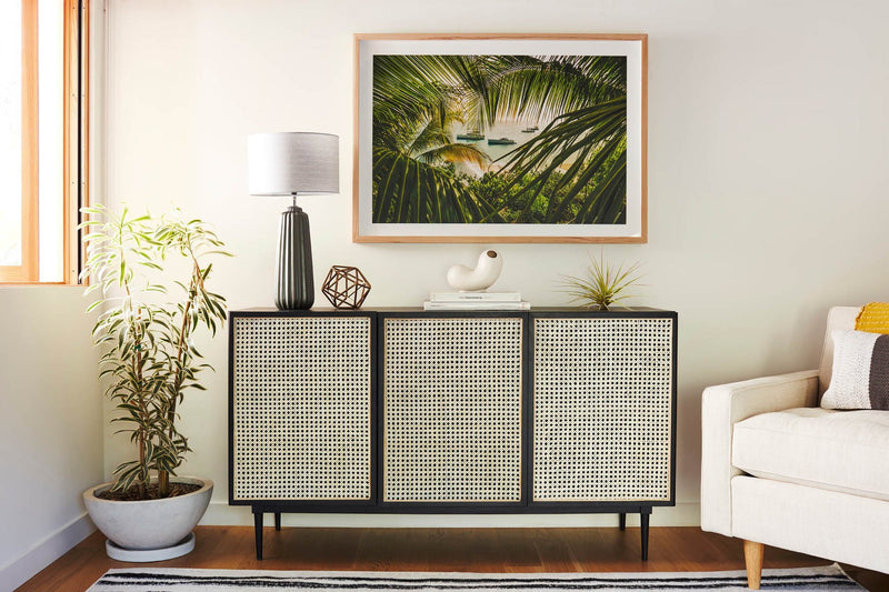 2. "Handcrafted cane sideboard with a rustic charm - ideal for farmhouse interiors"