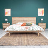 2. "Luxurious Gia King Bed with upholstered frame and button-tufted details"