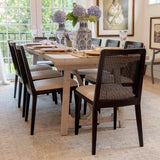 10. Cane dining chair in oyster linen with sleek black frame